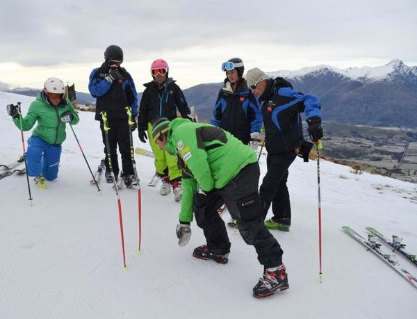 Head coach of the US men's alpine ski team, Sasha Rearick (centre front), in coaching session on Coronet Peak with (L-R) Celine Arnold, Tim Cafe, Giulia Faggian, Meghan Berber and Igor Stros.